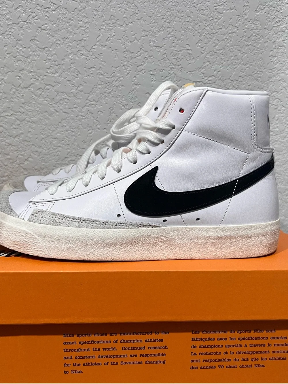 Nike White High-Top Sneakers with Black Swoosh